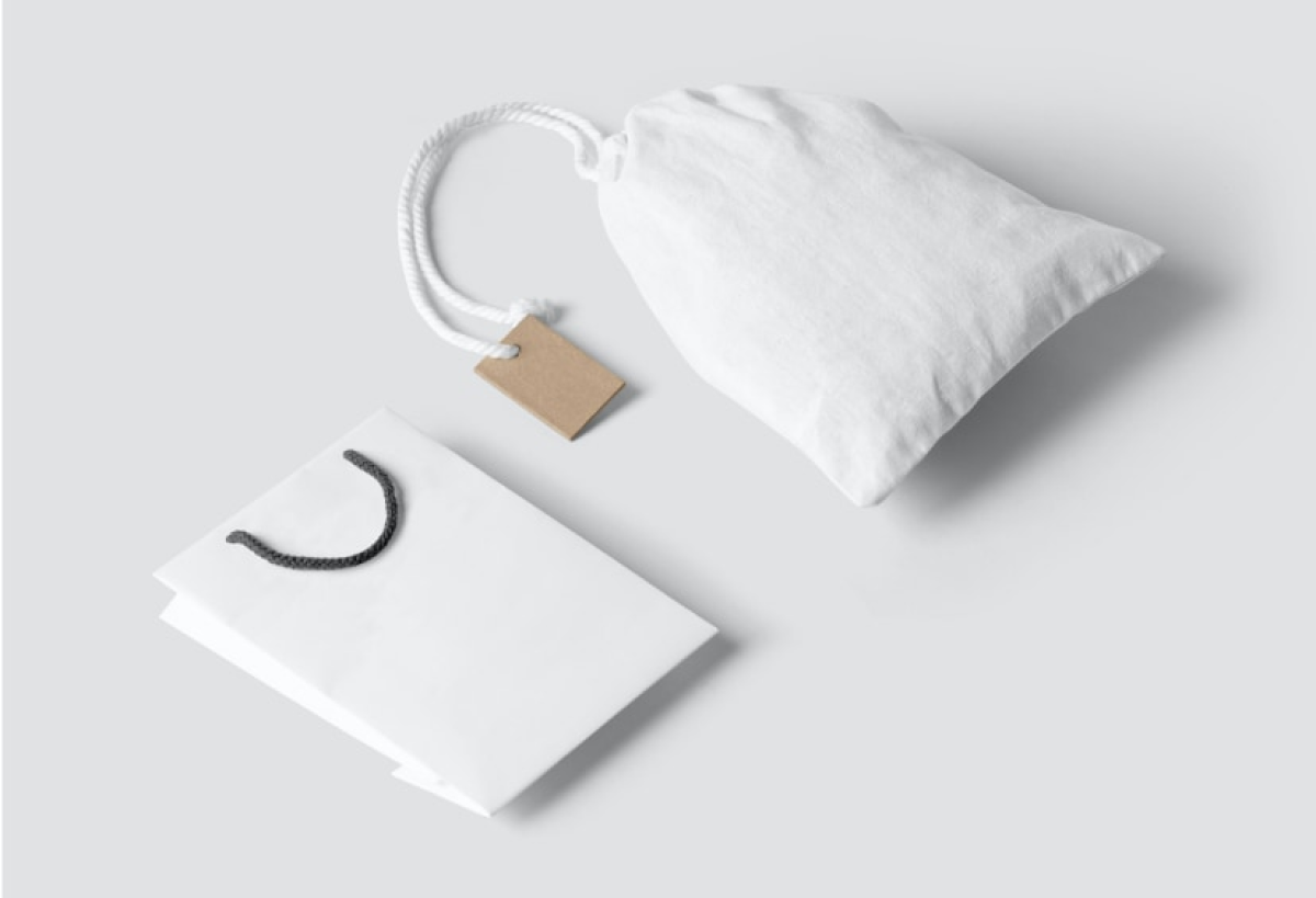 Two colleagues in the office looking at a laptop screen with a smile